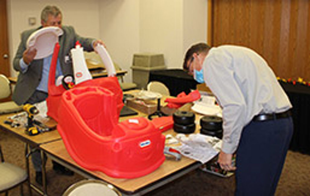 Gordon Watkins maintaining social distancing while assembling firetrucks