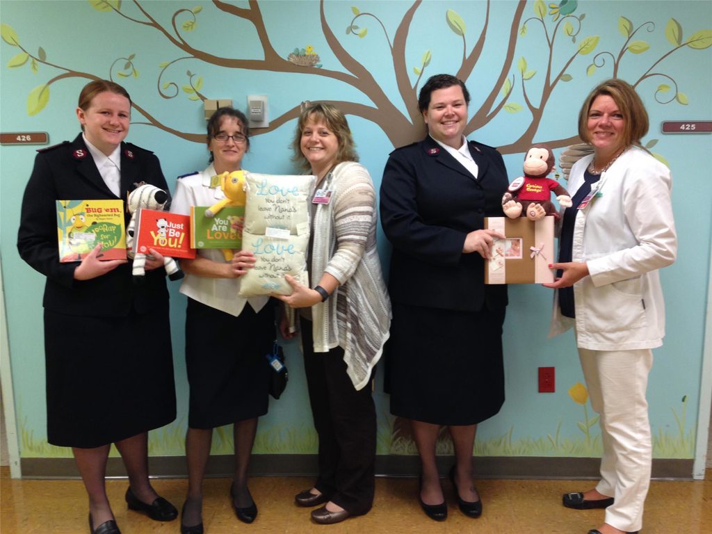 Salvation Army Lieutenants and volunteers with PH DuBois Pediatrics staff.